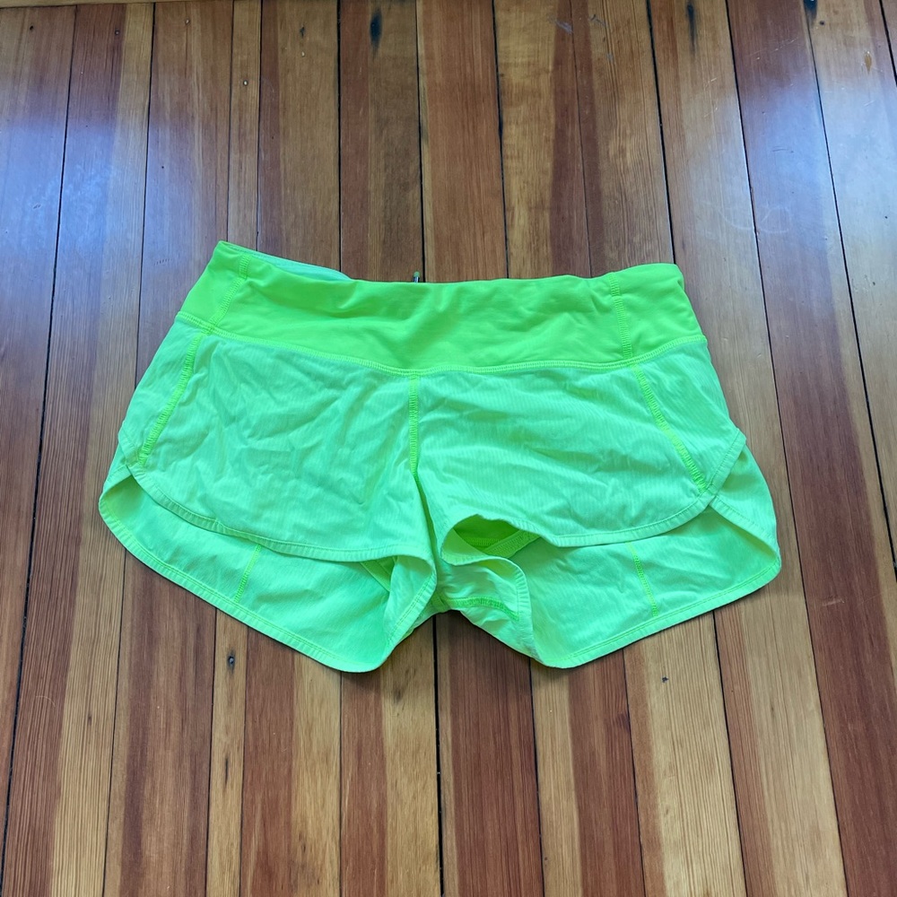 neon yellow/green lululemon shorts. low rise, 2.5 inseem